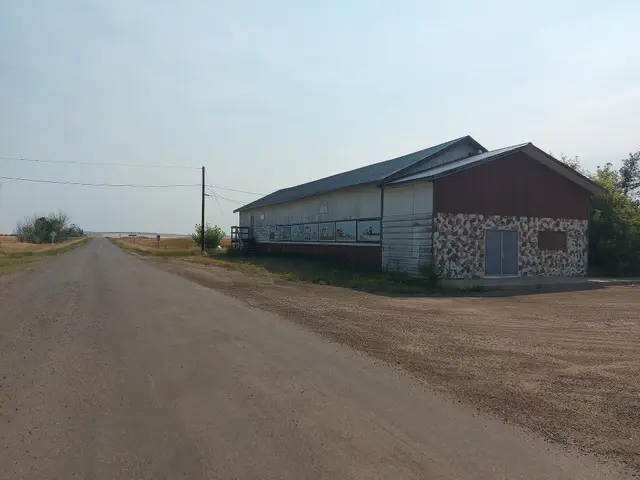 Hall with mural beside Highway 358